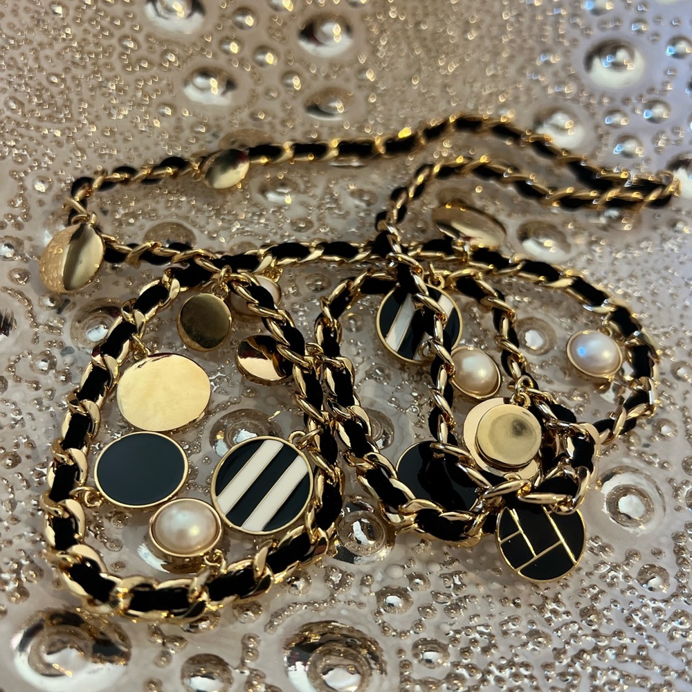 Black and gold tone woven long necklace